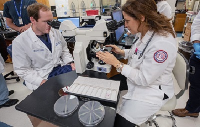 Fellow and faculty in research lab.jpg